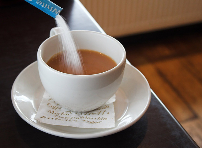the habit of putting sugar in coffee